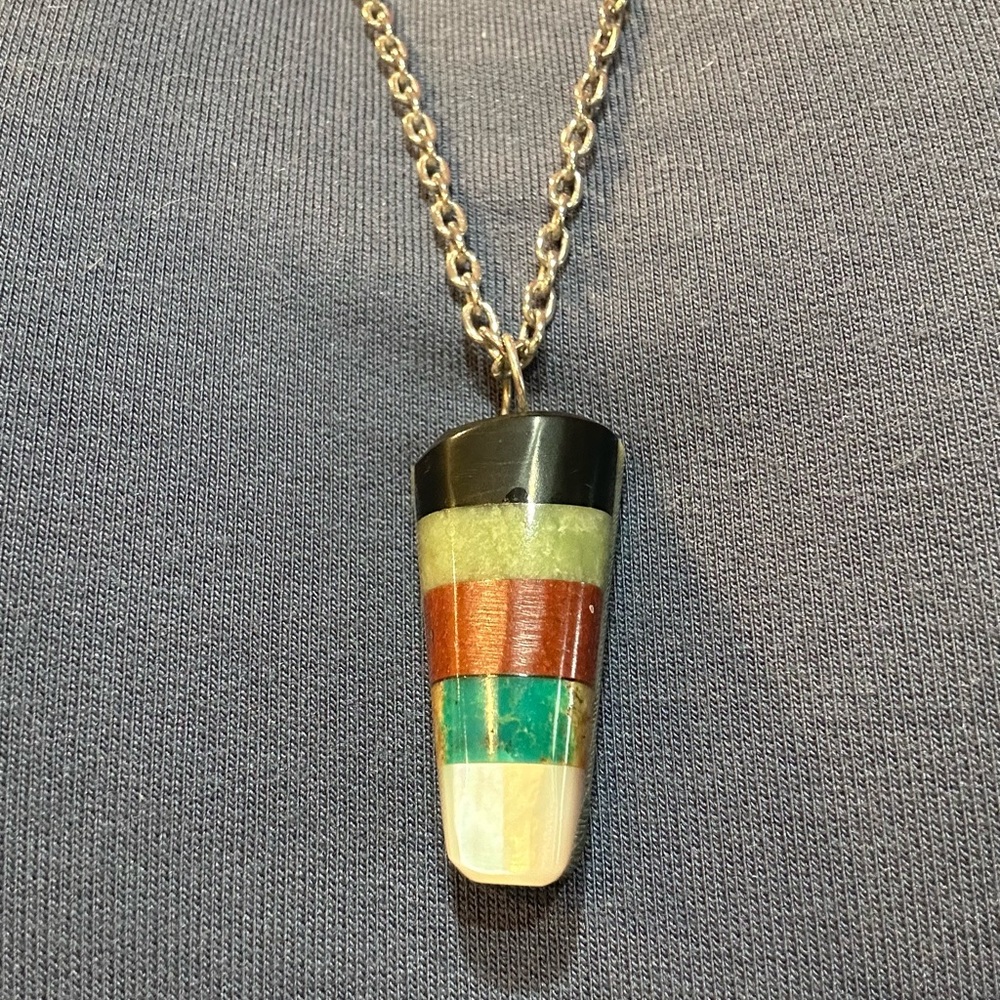 Unique polished stone pendant on silver chain